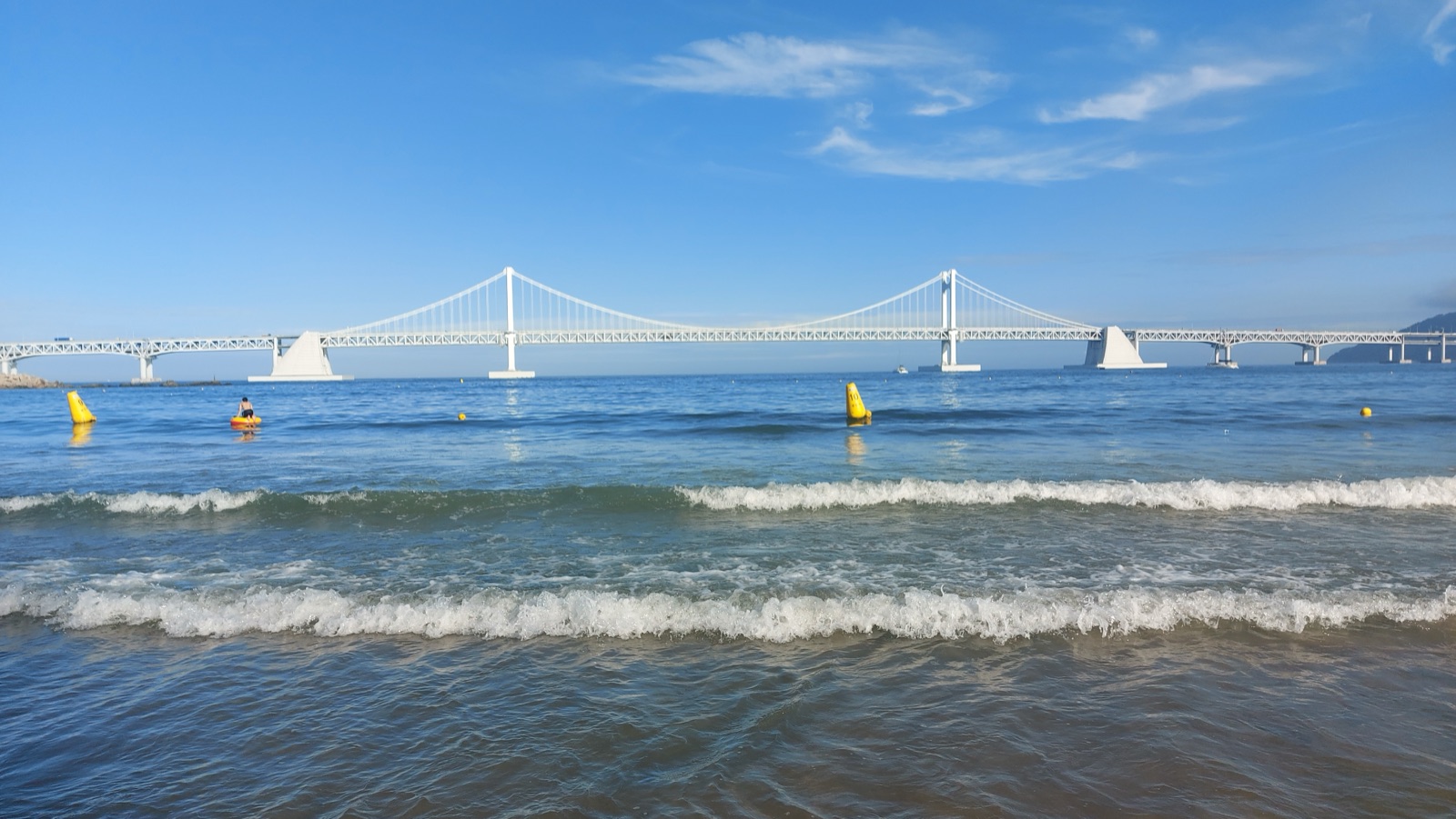 Gwangalli Beach and Gwangan Bridge in Busan, showing the evening beach area context for travelers comparing Busan beach bases.